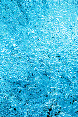 Frost. Winter background. Ice with close-up air bubbles. Winter.
