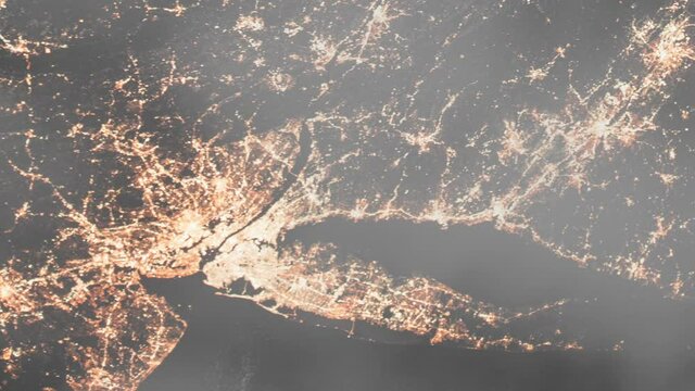 New York city view from space from a satellite during the night time.Contains public domain image by NASA.