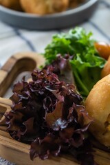 Bandung, Indonesia - January 24 2021 :  Chicken minced meat sandwich with salad toping