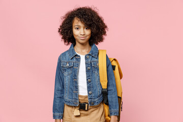 Smiling little african american kid school girl 12-13 years old in casual denim clothes with...
