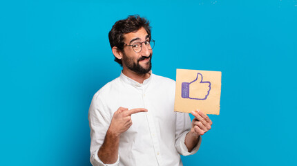 young bearded crazy man holding a social media like banner