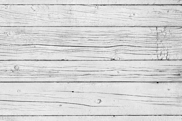 Naklejka premium Wooden background. Old black and white painted fence in good condition. Solid wooden wall from weathered cracked boards. Barn wood wall.