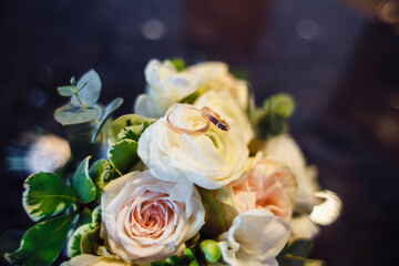 Wedding rings on the bride's bouquet