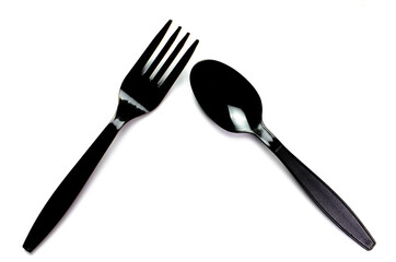 Black plastic cutlery knife fork spoon isolated on white background low highlight. For kitchen restaurant and table set up. concern to plastic conservative recycle items and one time use utensils