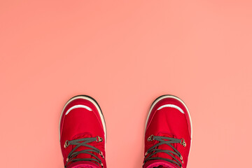 Kids or teenage pink winter boots isolated on pink background. Winter boots for girls. Top view banner