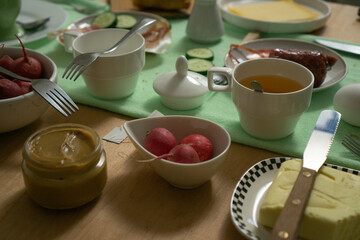 Served table for family dinner or breakfast with friends at home