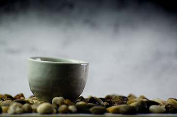 Japanese tradition Sake cup ceramic texture on black smoke background isolated