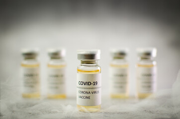 Coronavirus vaccine bottle isolated on white smoke background. Covid-19 situation disease pharmacy...
