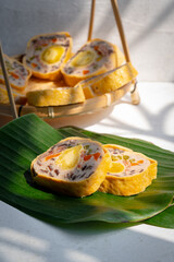 Mixed pork bologna roll with salted egg on green leaf decor asian food - Cha lua hoa