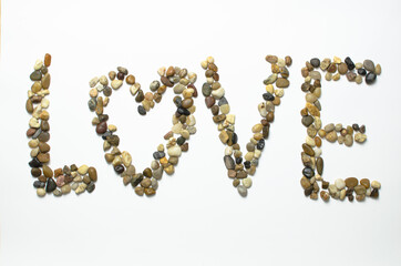 Love pebbles stone on white background isolated concern love and Valentine's day concept in February