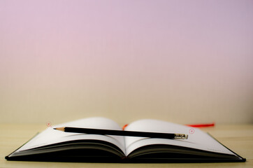Lovely open book pages, study notes, love letter diary for hobbies concepts. Warm and welcoming color tone. Set up up wood table clear white background