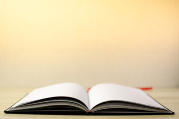 Lovely open book pages, study notes, love letter diary for hobbies concepts. Warm and welcoming color tone. Set up up wood table clear white background
