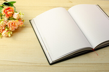 Lovely open book pages, study notes, love letter diary for hobbies concepts. Warm and welcoming color tone. Set up up wood table clear white background