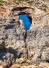 Rocky seashore and blue sea