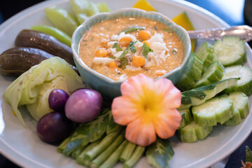 Spicy chili crab eggs served with vegetables on the big dish.