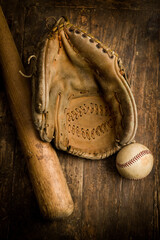 Grungy old baseball gloves and ball