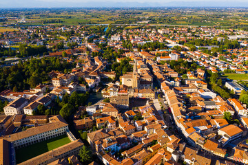 Scenic cityscape from drone of Italian town of Portogruaro in sunny day, Veneto, Italy
