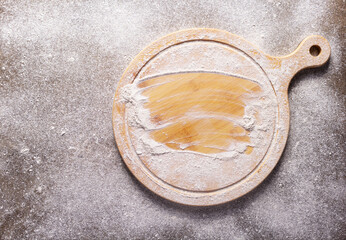 Flour food and pizza cutting board as bakery concept for homemade bread baking on table