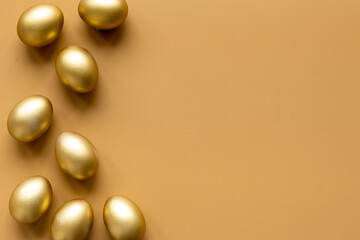 Golden eggs. Easter decoration background. Top view