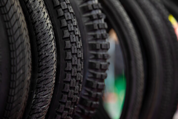 Bicycle tires in close-up. Tire texture. Black background.