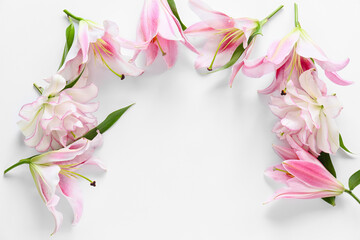 Obraz na płótnie Canvas Beautiful lilies on white background