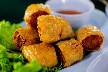 Deep fried crab meat ball with plum sauce close up