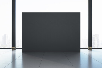 Minimalistic gallery room with blank gray exhibition stand