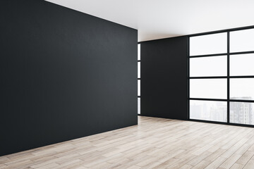 Modern gallery interior with blank black wall and city view.