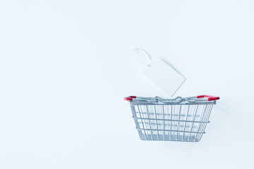 New Normal concept basket shopping online on white background texture, Copy space for text. COVID-19, Coronavirus pandemic.