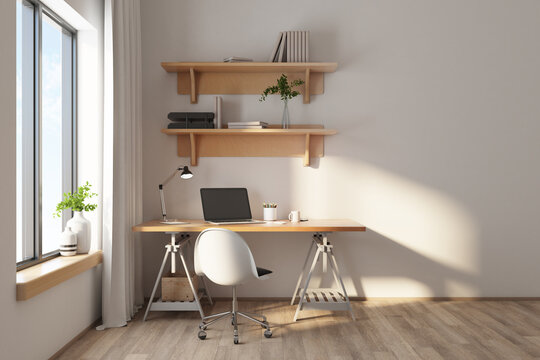 Designer desktop with laptop on wooden table