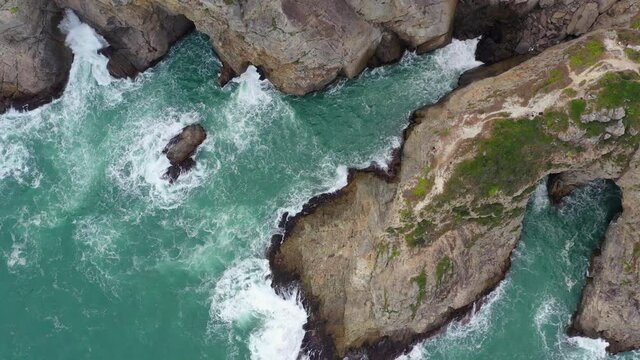 Top down view of the sea crash on rock