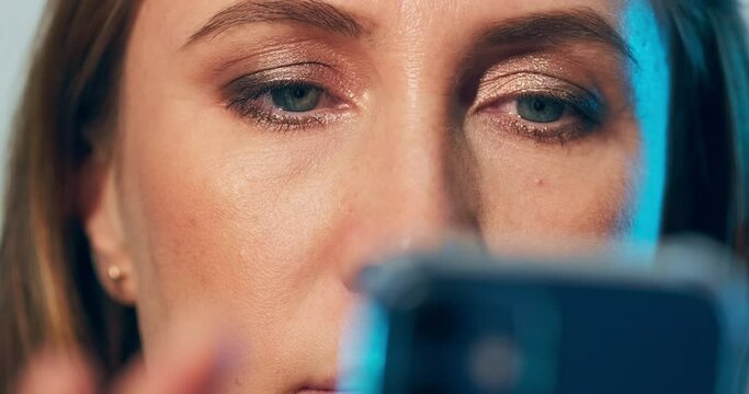 Woman and smart phone. Extreme close up shot of the woman with blue smart phone