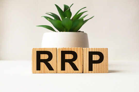 a word RRP on wooden cubes. business concept. business and Finance