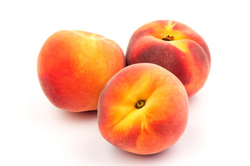 Summer fruit background. Ripe juicy peaches on white background. Copy space. Fresh organic fruit vegan food. Harvest concept
