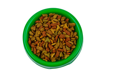 Dry food for cat or dog in a bowl. Pet food isolated on white background