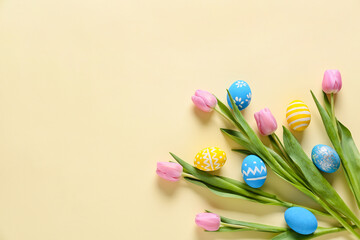 Composition with beautiful Easter eggs and flowers on color background