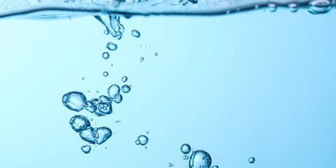 The flow of water creates a splash and the blue waves underwater, and the bubbles naturally flow to...