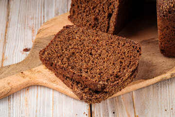 Closeup on sliced rye bread on the wooden cutting board