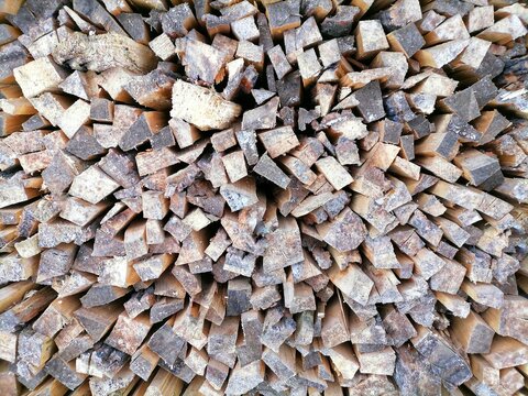 Background of stacked wall of firewood