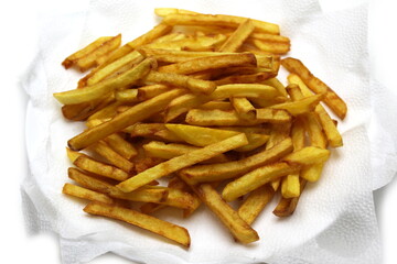 delicious fried fries lying on a napkin