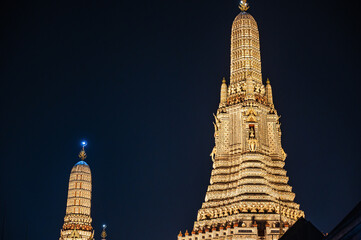 Wat arun with  roof top of the building in the night time.Wat Arun Ratchawararam Ratchawaramahawihan or Wat Arun is a Buddhist temple in Bangkok Yai district of Bangkok
