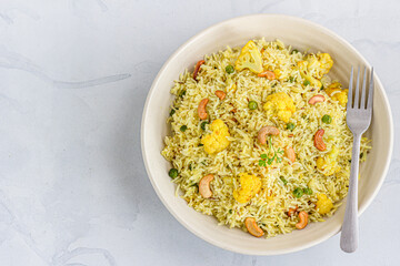 Indian Style Fried Rice with Cauliflower in a Bowl Top Down Photo