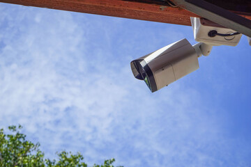 Dirty CCTV cameras are installed on the eaves for detecting property theft. CCTV security camera outdoors.