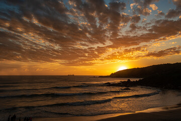 Fototapeta na wymiar Sunrise Light over the beach on a summer day in Brazil