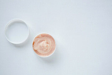 Beauty skin care concept on light background. Face cream. Place for text. View from above. Summer or autumn body care concept