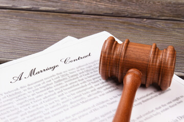 Close-up wooden gavel. Marriage contract concept.