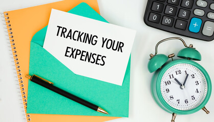 Card on a postal envelope with the text TRACKING YOUR EXPENSES
