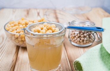 Close-up of an aquafaba of filtered chickpea broth. It is used as an alternative to chicken eggs in recipes for vegans