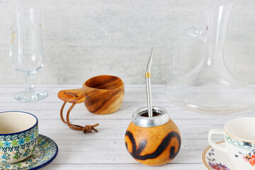 Different drinking objects on gray table background. Cups, glasses accessories.