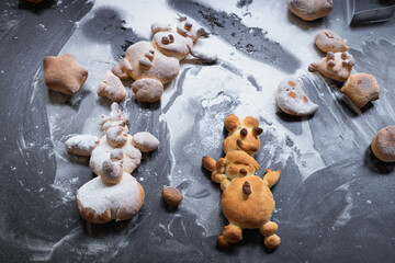 Kids activity with bread dough, baked snowman and other figures 